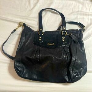 Black coach bag with gold zipper